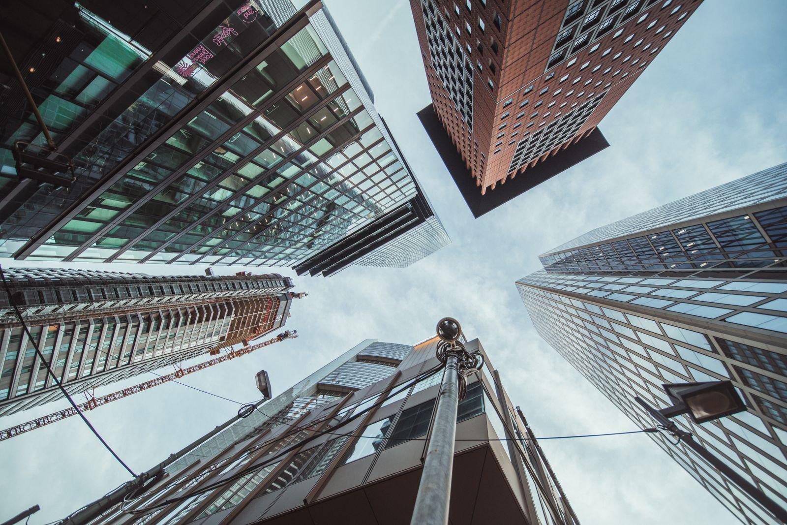 Looking up at modern glass skyscrapers