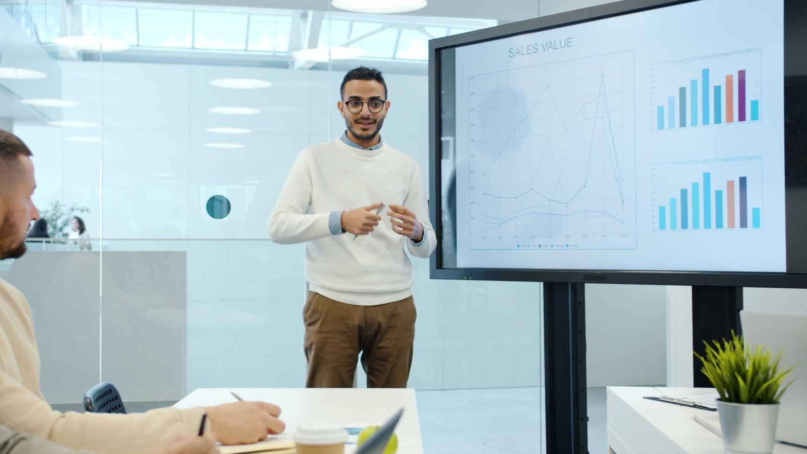 Business presentation with charts in a modern office