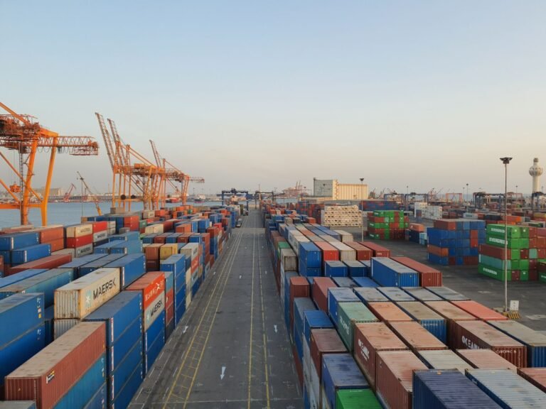 Port with cargo containers at sunrise