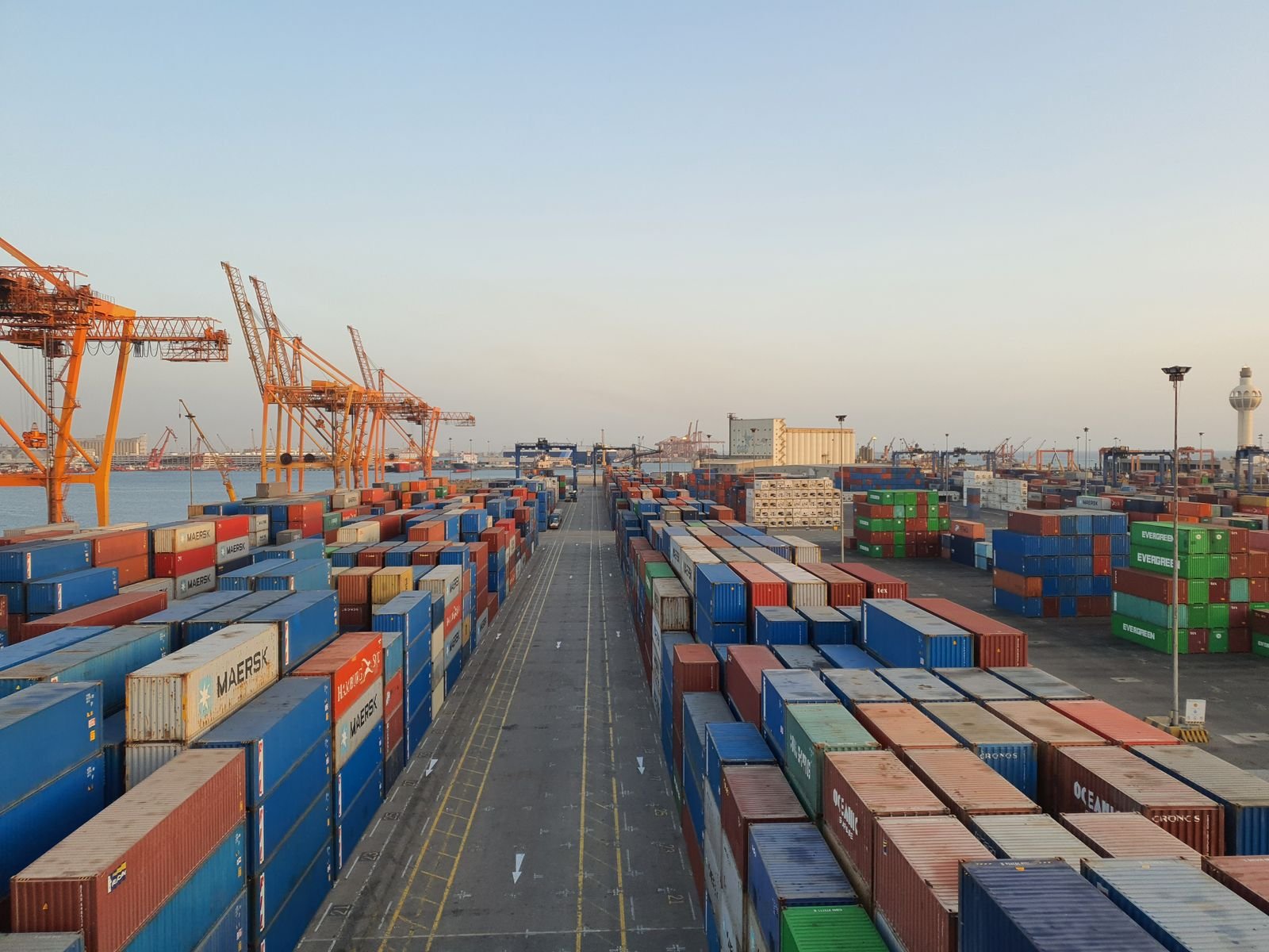Port with cargo containers at sunrise